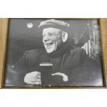 A Charles Hewitt photograph of a gentleman with a print, titled verso 'The East End 1946', 14" x 10"