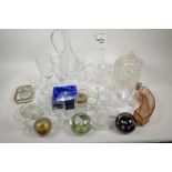 A box of miscellaneous glassware including paper weights, ship's decanter, etched wine glasses, wine