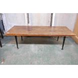 A mid century Meredew teak coffee table, raised on ebonised supports, 18" x 46" x 14"