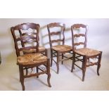 A set of four French country chairs with rush seats
