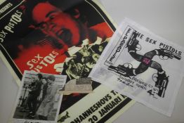 A collection of Sex Pistols ephemera to include a newspaper cutting advertising the 1976