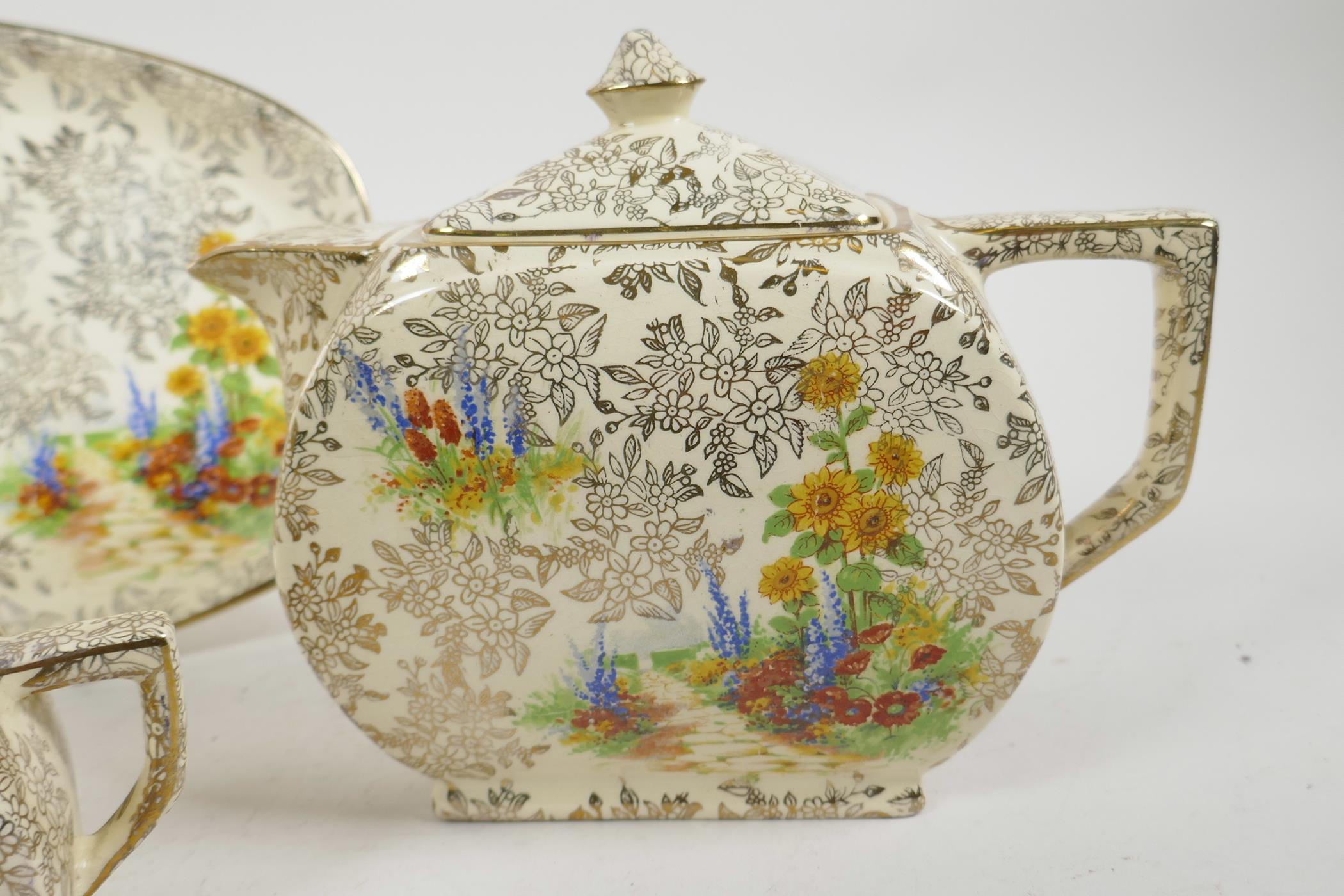 An Art Deco Empire Ware porcelain Garden Pattern teapot, water jug, milk jug and serving plate ( - Image 2 of 6