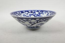 A Chinese Ming style blue and white porcelain conical bowl with dragon and lotus flower