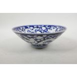 A Chinese Ming style blue and white porcelain conical bowl with dragon and lotus flower