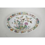 A Chinese polychrome porcelain oval dish with enamel decoration of birds and flowers, 6 character