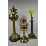 Two brass column table oil lamps, converted to electricity, together with a brass reeded column