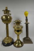 Two brass column table oil lamps, converted to electricity, together with a brass reeded column