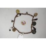 A twin strand charm bracelet set with replica medieval coins and tokens, 12" long, and a Limoges