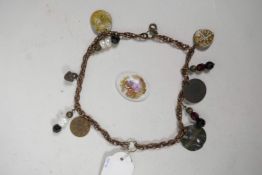 A twin strand charm bracelet set with replica medieval coins and tokens, 12" long, and a Limoges
