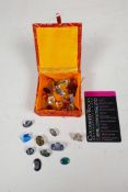 A quantity of loose polished gemstones, unsorted but appear to be topaz, opal, tourmaline, citrine