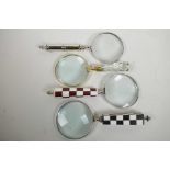 Four desk top magnifying glasses, lens 4" diameter