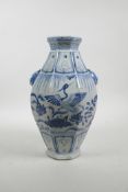 A Chinese Ming style blue and white porcelain vase of octagonal form with two lion mask handles