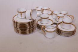 A Haviland Limoges ten place tea service, with gilt borders and key pattern decoration, c1930