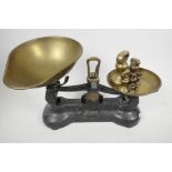 A set of vintage 'Libra' cast iron kitchen scales with brass pans and set of brass bell weights, ¼oz