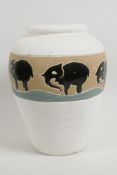 A studio pottery vase decorated with stylised elephants, 8½" high