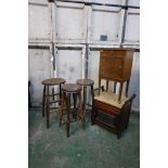 An antique elm bar stool with elm seat, two others, a piano stool and pot cupboard