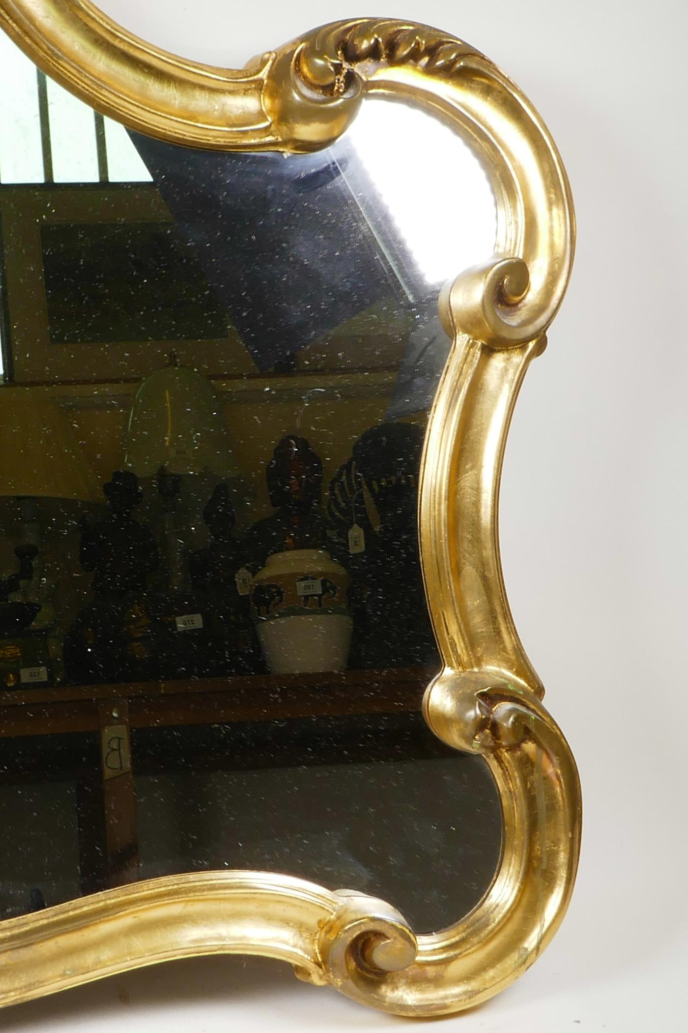 An elaborate Rococo style mirror with a gilded scrolling frame, in good condition, 32" wide x 70" - Image 3 of 7