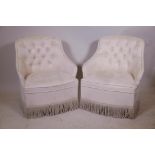 A pair of bedroom tub chairs with faux suede button back upholstery, raised on turned supports