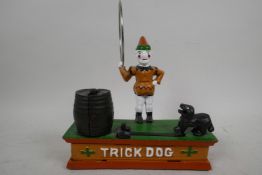 A replica trick dog cast iron money box, 7½" long