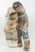 A large Lladro porcelain figure of two Inuit children, 15½" high