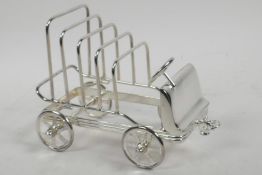 A silver plated toast rack in the form of a vintage car, 6½" long
