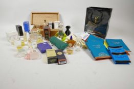 A box of vintage perfume bottles, some with contents including Yves Rocher, Givenchy, Michele