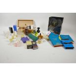 A box of vintage perfume bottles, some with contents including Yves Rocher, Givenchy, Michele