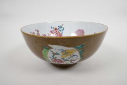 An C18th Chinese export porcelain Batavia ware bowl, lustre glazed brown ground with famille rose