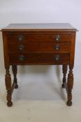 A mahogany three drawer canteen on turned and carved legs, 19" x 27", 30½" high