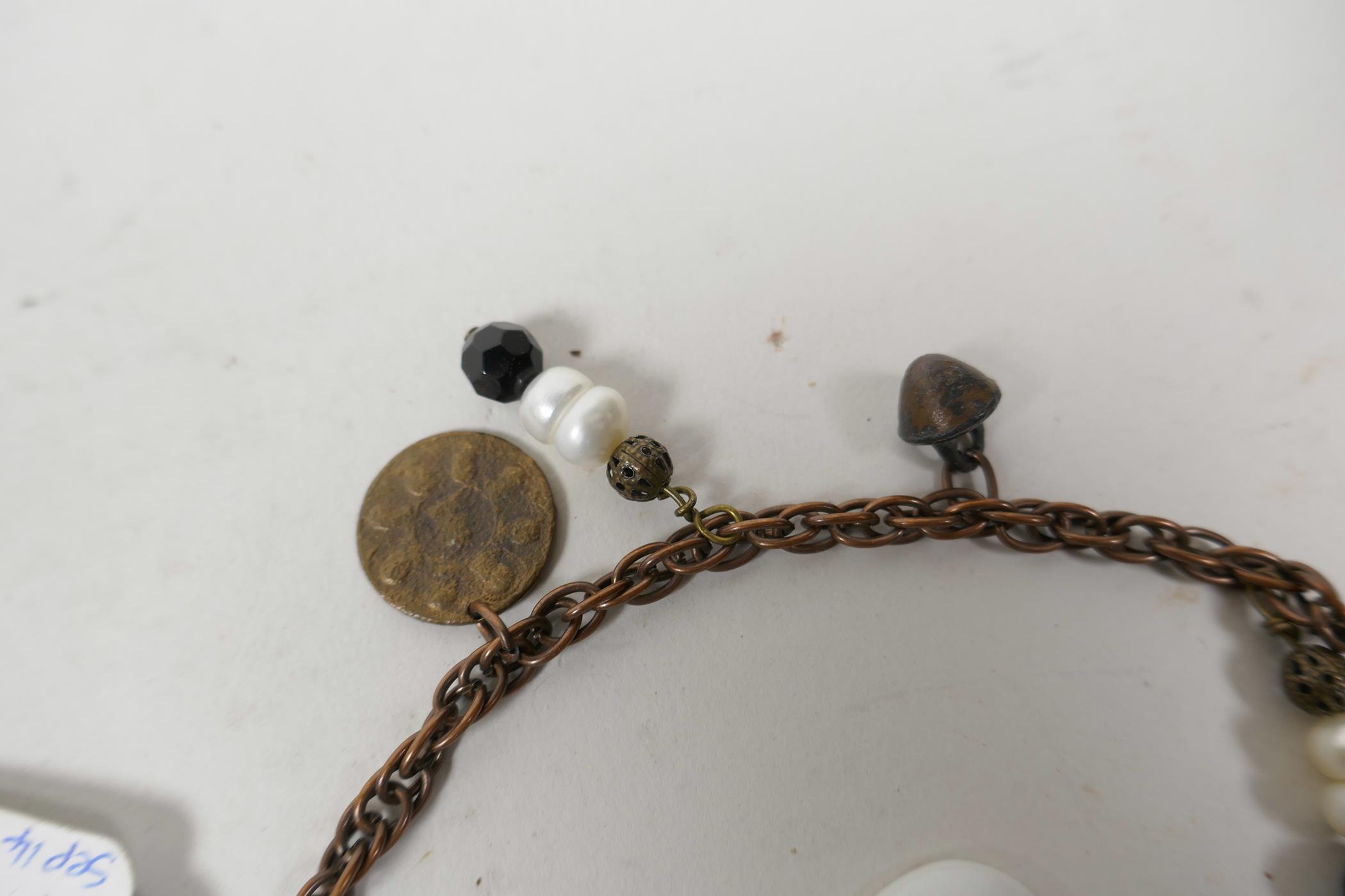 A twin strand charm bracelet set with replica medieval coins and tokens, 12" long, and a Limoges - Image 5 of 5