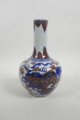 A Chinese blue and white porcelain bottle vase with fo dog decoration highlighted with red, 4