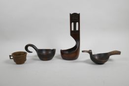 A Scandinavian carved wood kuksa cup, a similar long stemmed ladle, a Russian Skopkar carved wood