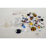 A collection of loose cut gemstones, including topaz, tourmaline, garnet and a variety of