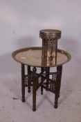 An Egyptian brass tray top table on a turned wood collapsible base, together with a Middle Eastern