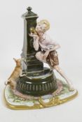 An Italian porcelain figurine of a young boy and his dog at a drinking fountain