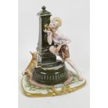 An Italian porcelain figurine of a young boy and his dog at a drinking fountain