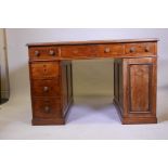 An early C19th mahogany partner's desk, with inset gilt tooled leather top, three drawers over