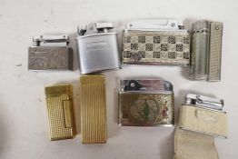 Eight lighters to include a Dunhill Rollalite, Prince Musical box lighter, Monopol, and a Dunhill