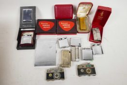 Various pocket lighters to include Ronson, a Thorens Case lighter with automatic operation, two