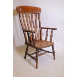 A C19th Windsor elbow chair with elm seat