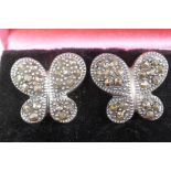 A pair of silver and marcasite butterfly style earrings