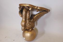 A C19th carved giltwood wall bracket in the form of a swan, the top pointed as marble, 18" high x