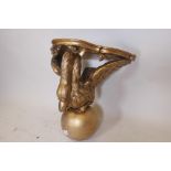 A C19th carved giltwood wall bracket in the form of a swan, the top pointed as marble, 18" high x