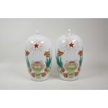 A pair of Chinese polychrome porcelain jar and covers with enamelled decoration depicting the