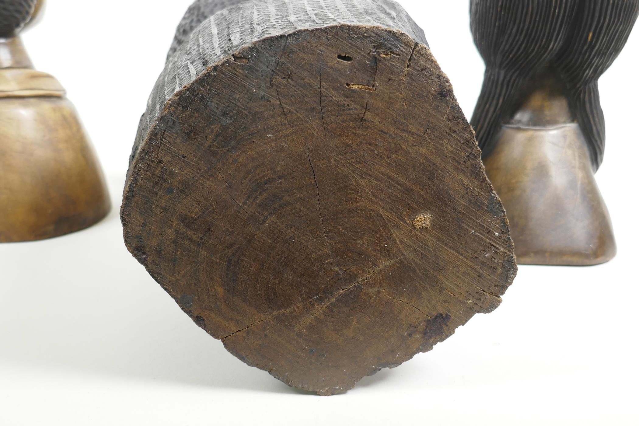 An African carved wood bust of a pipe smoking gentleman together with a pair of carved hardwood - Image 4 of 4