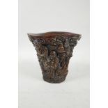 A Chinese faux horn libation cup with carved decoration of the Eight Immortals, 4 character mark