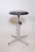 An industrial enamelled metal adjustable swivel stool