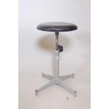 An industrial enamelled metal adjustable swivel stool