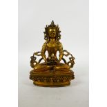 A Sino-Tibetan gilt bronze of Buddha seated on a lotus throne, impressed double vajra mark to
