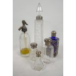 Three glass dressing table bottles with Hallmarked silver tops, together with three others with